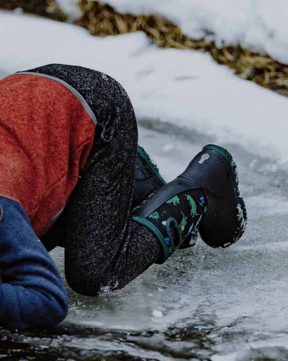 Image features the kids York Jurassic Dino boot on ice. 