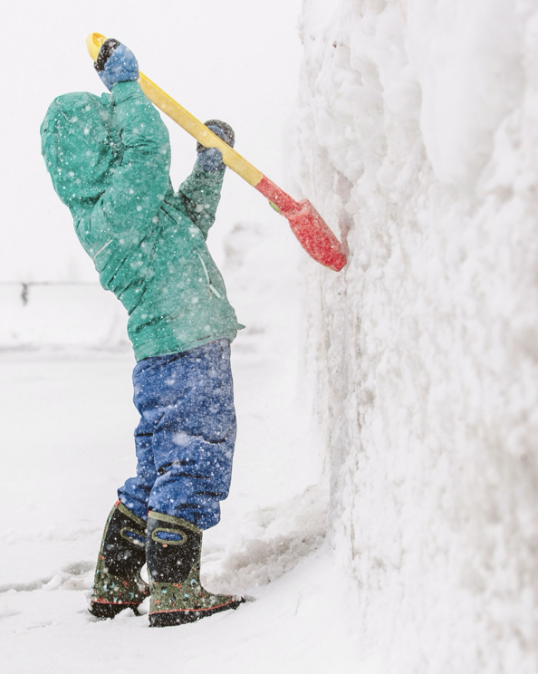 The image is a kid with a shovel, digging up the side of a snow mound.  BOGS last pairs left sale. Kids' Boots $29.90, Non-Insulated Boots $39.90 & Insulated Boots $49.90.  Shop now, before they are gone. 