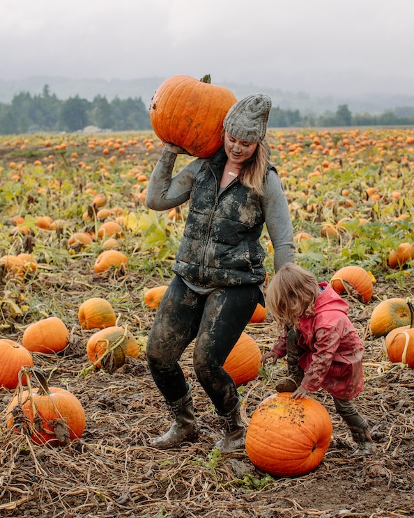 The image shown is a mom and wife in a muddy pumpkin patch.  Fall is officially here, get your pumpkin & shop our kids boots.