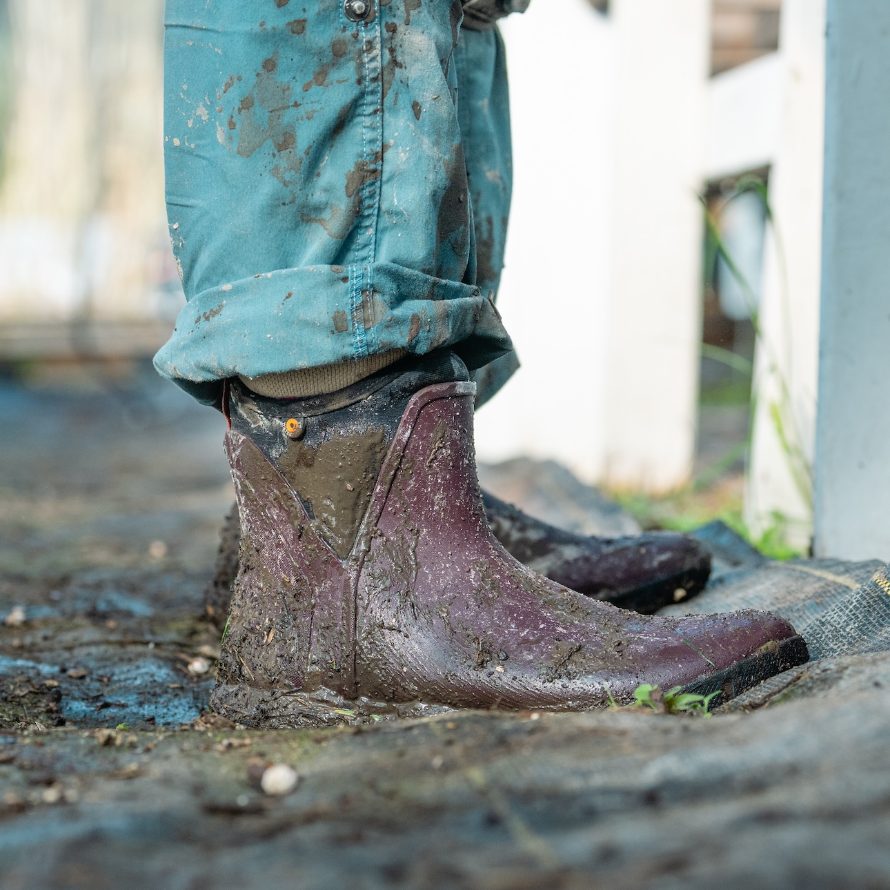 The image shown is a closeup image of our muddy waterproof Women's Sauvie Slip On boot in maroon.